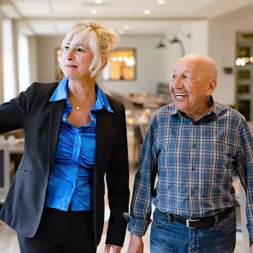 Chartwell Staff showing around the residence to a senior