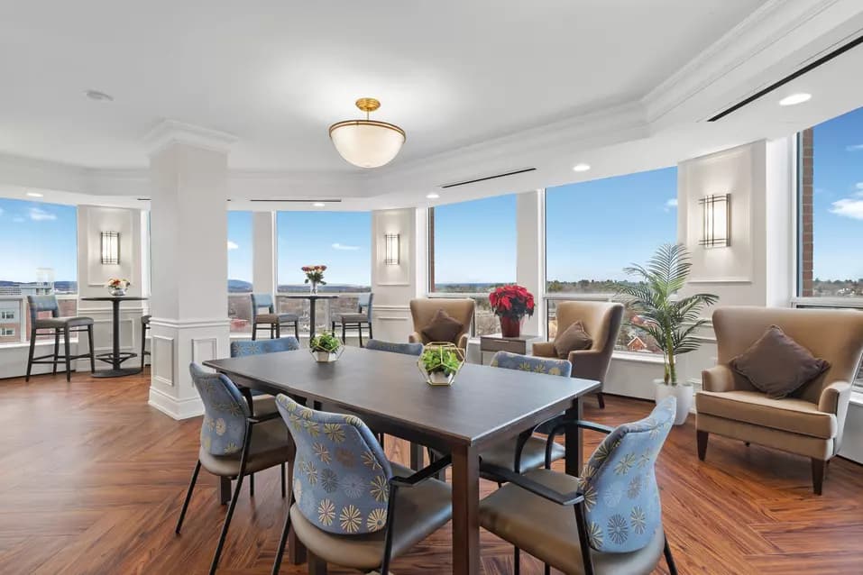 lounge area with views of rideau river at chartwell rockcliffe retirement residence