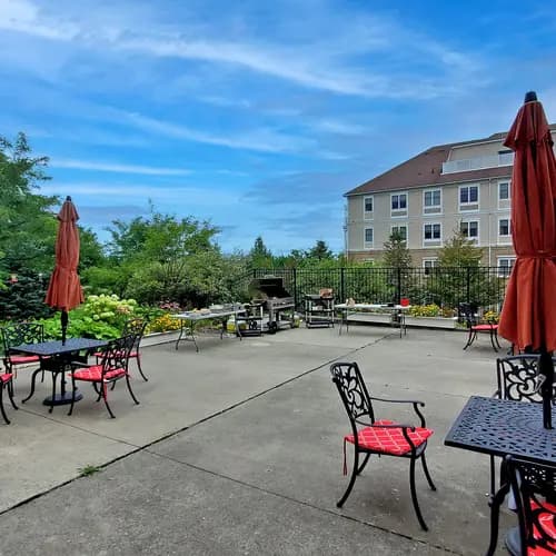 Patio with table and chairs at Chartwell Strathroy