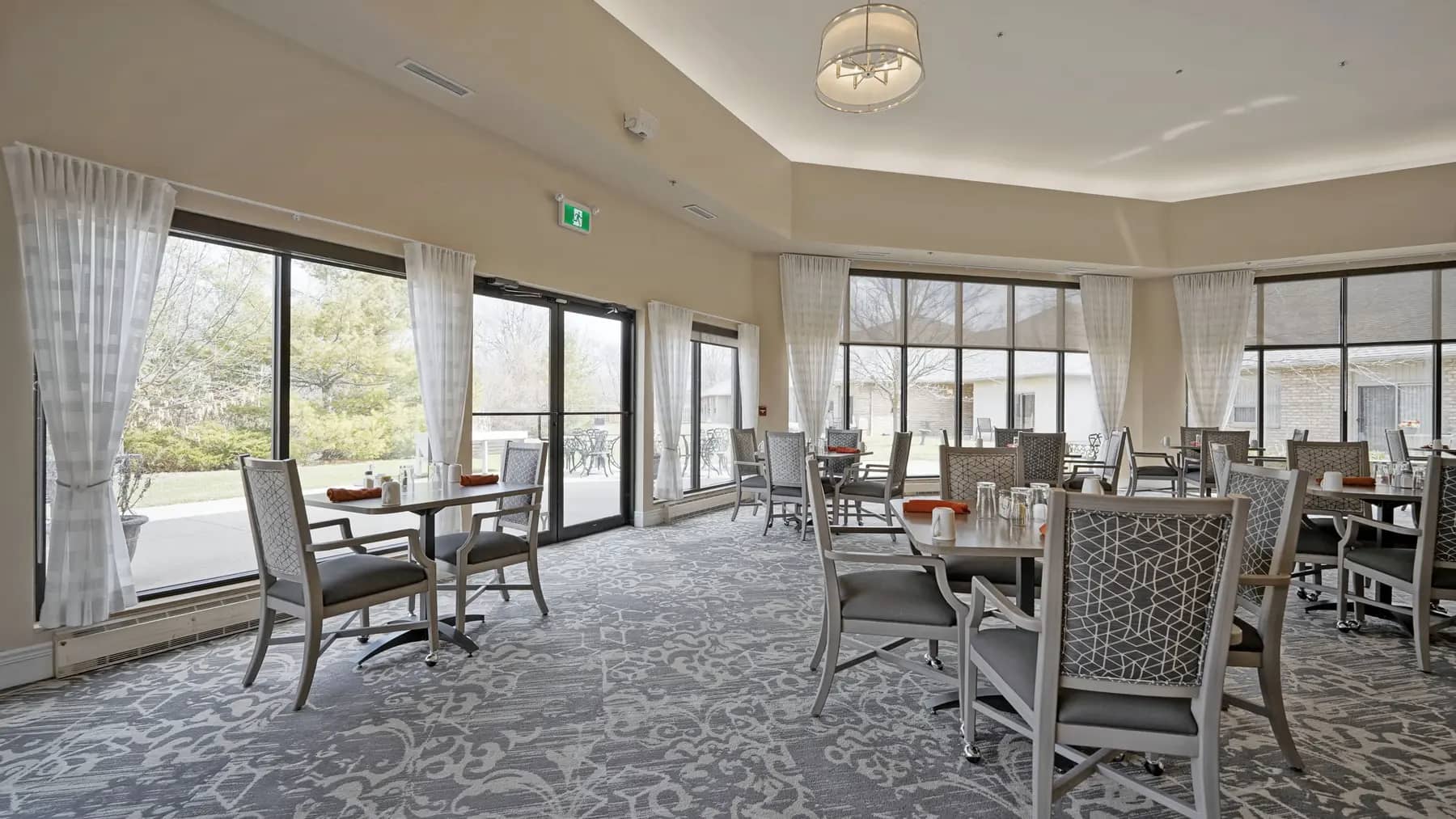 Dining room with table and chairs at Chartwell Belle River