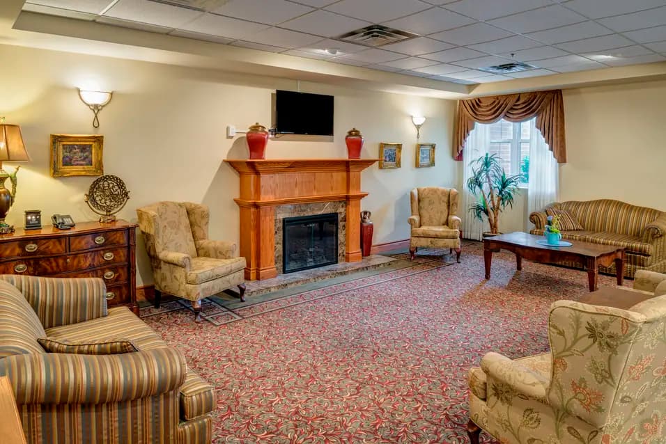 Lounge with wing back chairs at Chartwell Amherstburg