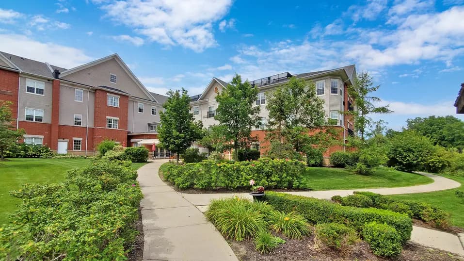 Close up exterior with sidewalk and green space at Chartwell Franklin Park