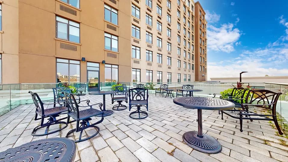 Patio with table and chairs at Chartwell Stoney Creeek