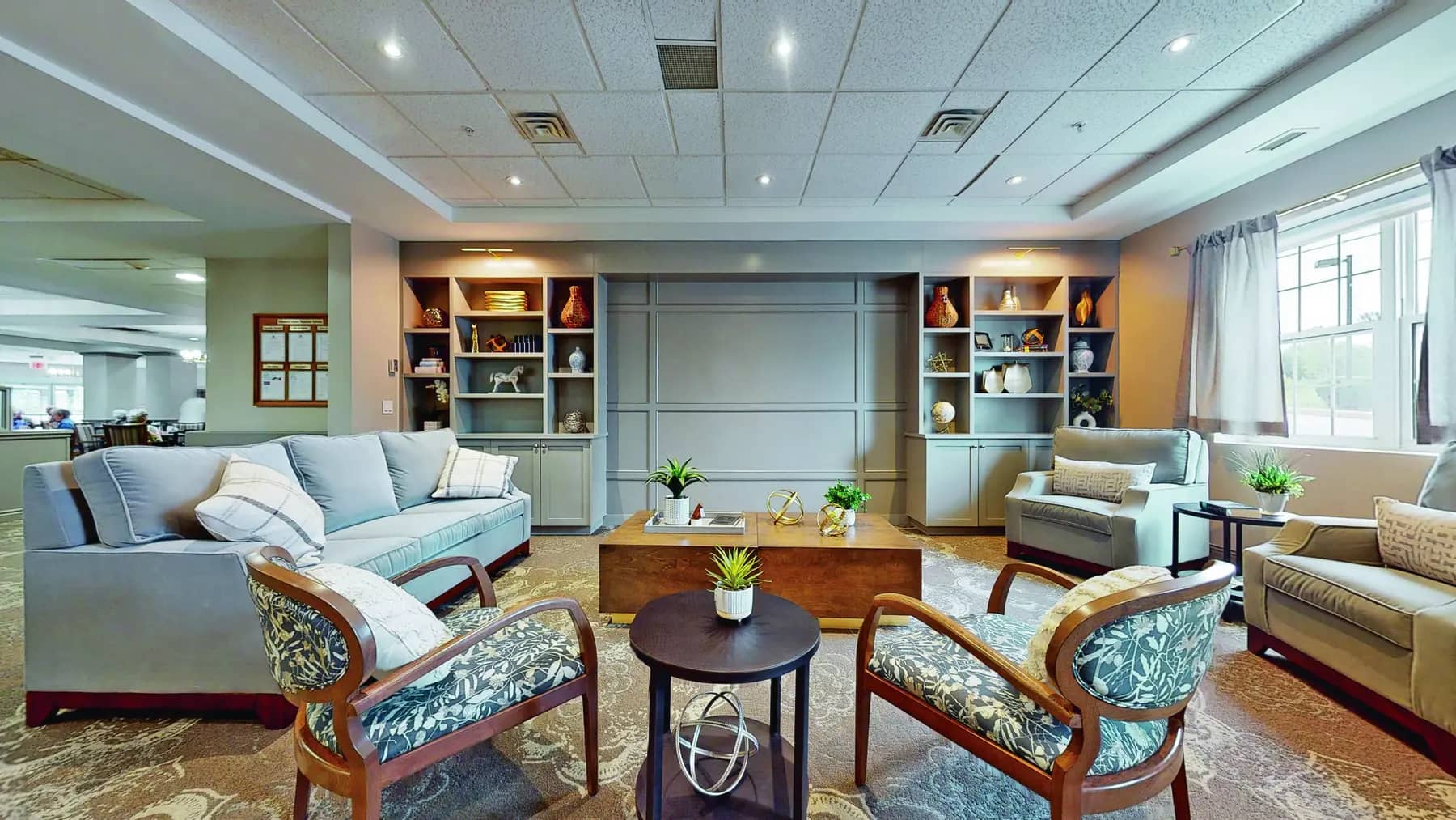 Alternative view of lounge with table and chairs at Chartwell Owen Sound
