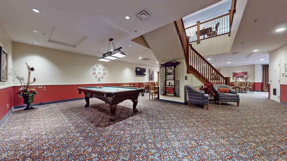 Activity area with pool table at Chartwell Strathroy