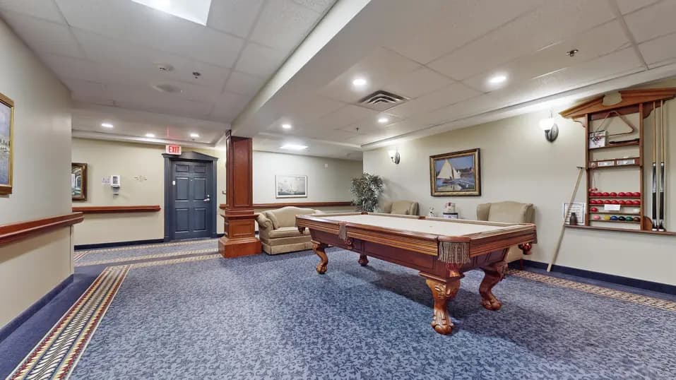 Activity room with pool table at Chartwell Welland