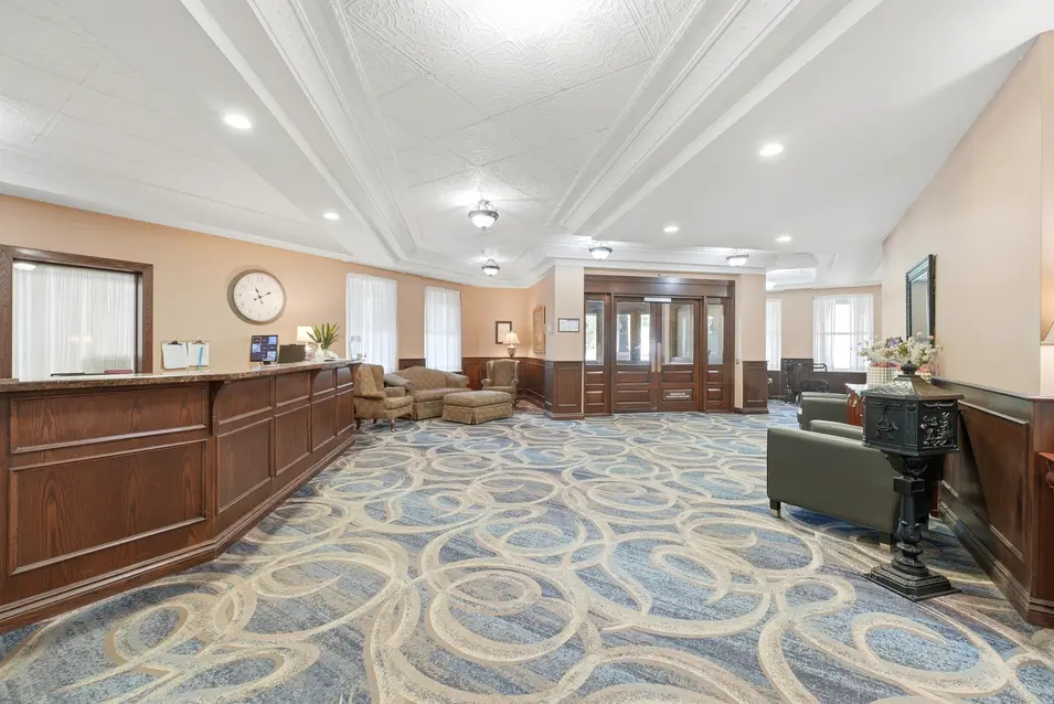 Entrance lobby with reception desk and lounge seating at Chartwell Riverside