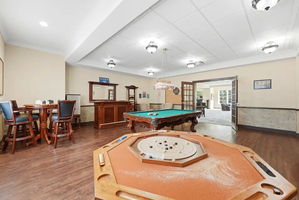 Games room with pool table and table games at Chartwell Riverside