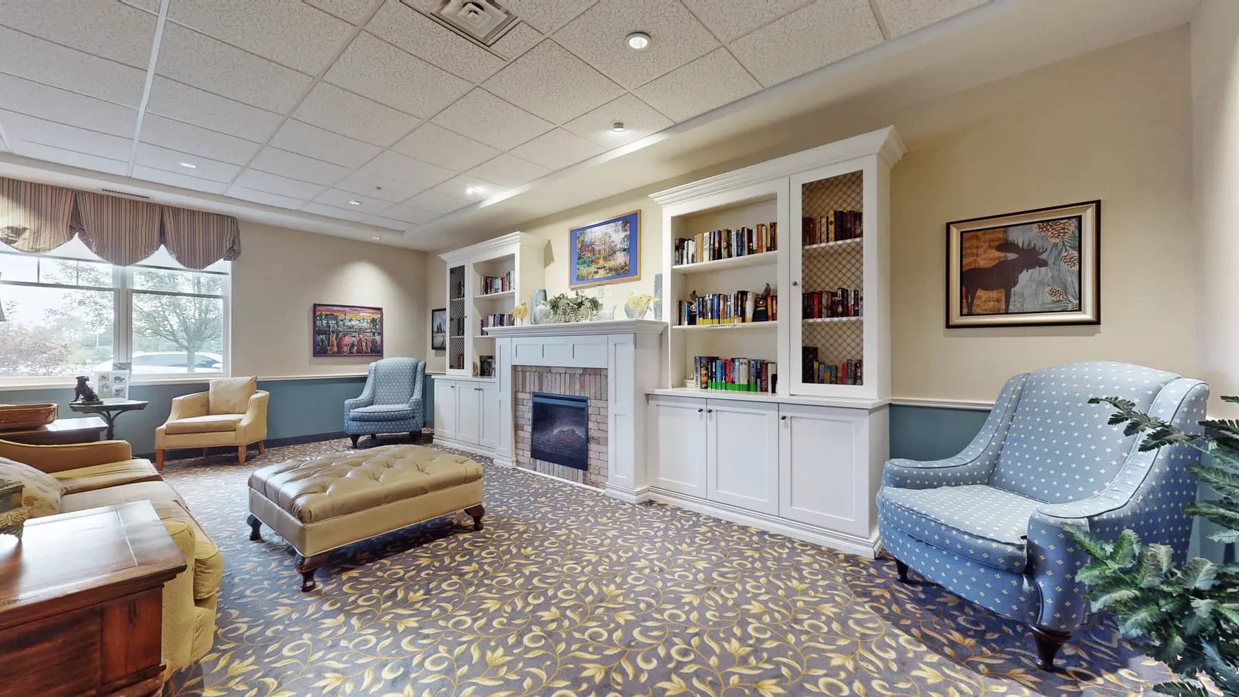 Lounge with wing back chairs at Chartwell Strathroy