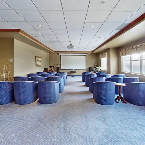 Theatre with blue chairs at Chartwell Royal Oak Village