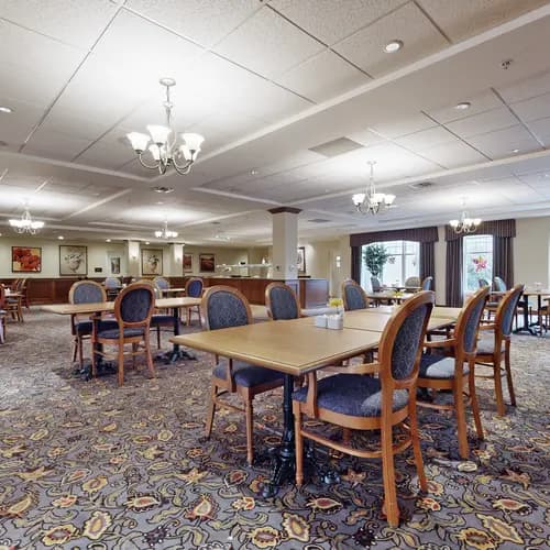 Dining room with table and chairs at Chartwell Strathroy