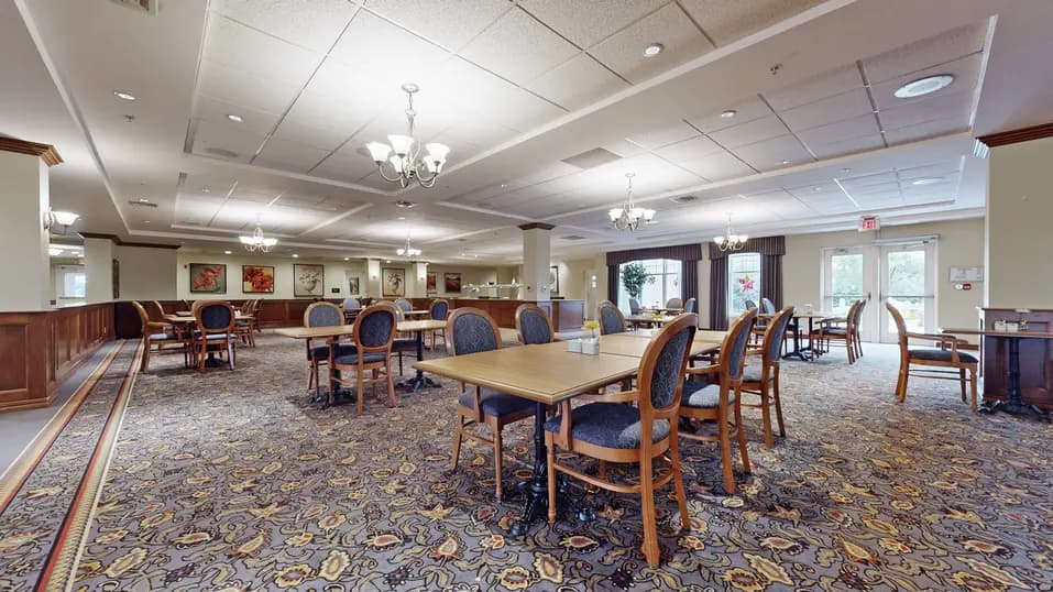 Dining room with table and chairs at Chartwell Strathroy