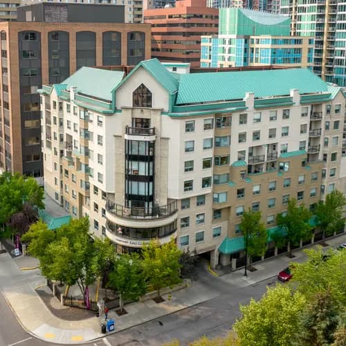 wide angle exterior drone picture with views of downtown Calgary at chartwell eau claire care residence