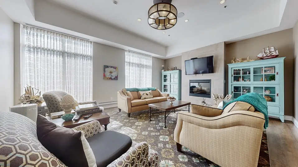Lounge with chairs and couch at Chartwell Stoney Creeek