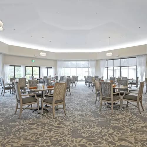 Dining room with table and chairs at Chartwell Belle River