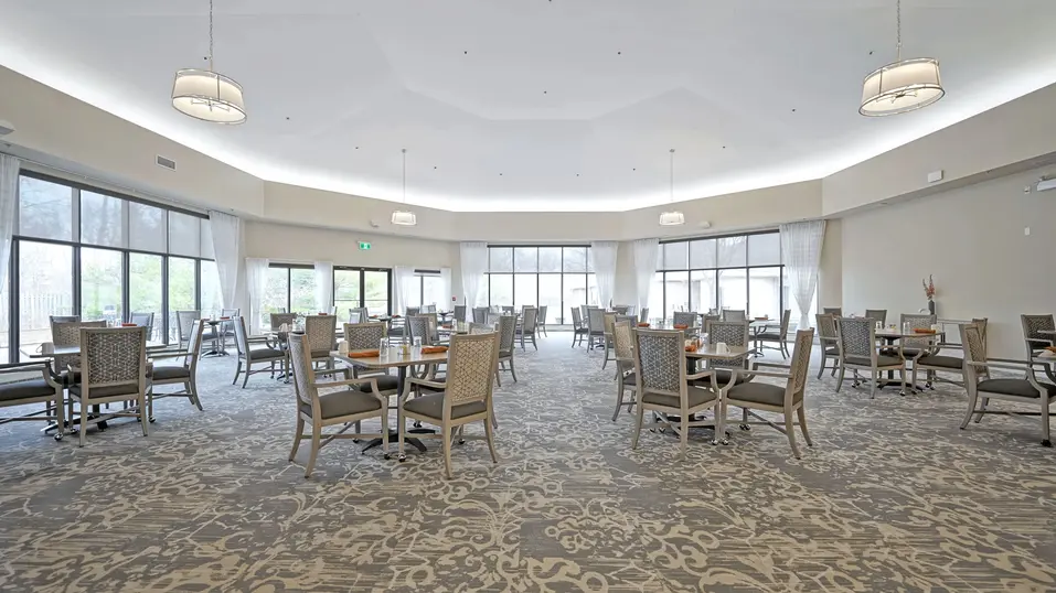 Dining room with table and chairs at Chartwell Belle River