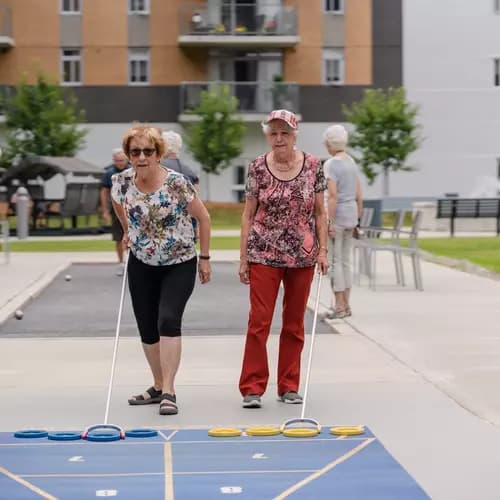 Senior ladies playing shuffle board