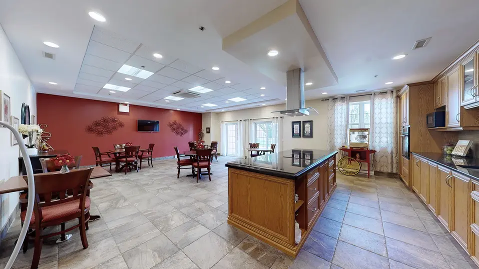Full view of country kitchen with table, chairs and countertop at Chartwell Amherstburg