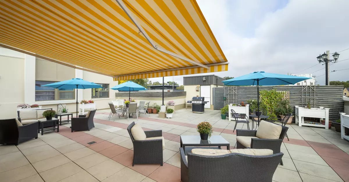 Chartwell Avondale Retirement Residence third floor patio with patio furniture, awning and bbq. 