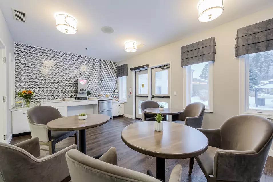 Bistro with lounge seating at Chartwell Whispering Pines Retirement Residence.
