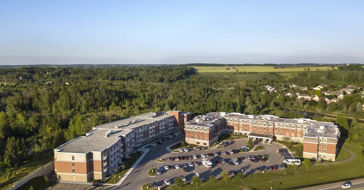 Chartwell Montgomery Village Retirement Residence aerial photo of surrounding woods