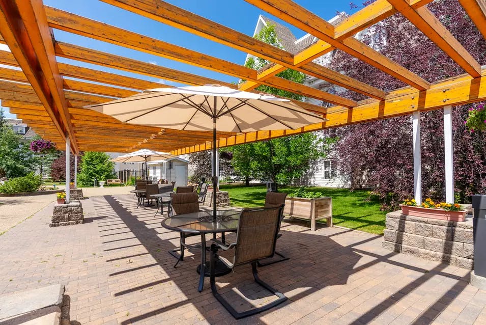 chartwell griesbach, pergola, courtyard, umbrellas, tables, chairs, patio table