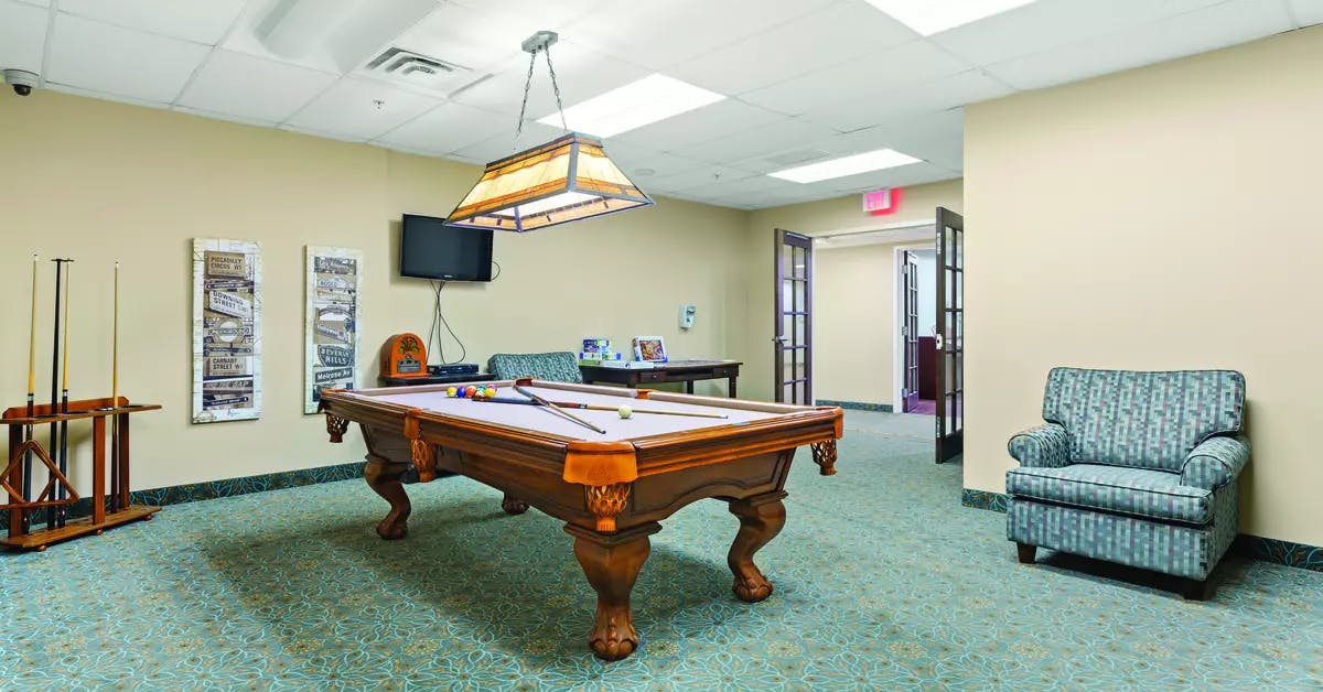 billiards room at chartwell wynfield retirement residence
