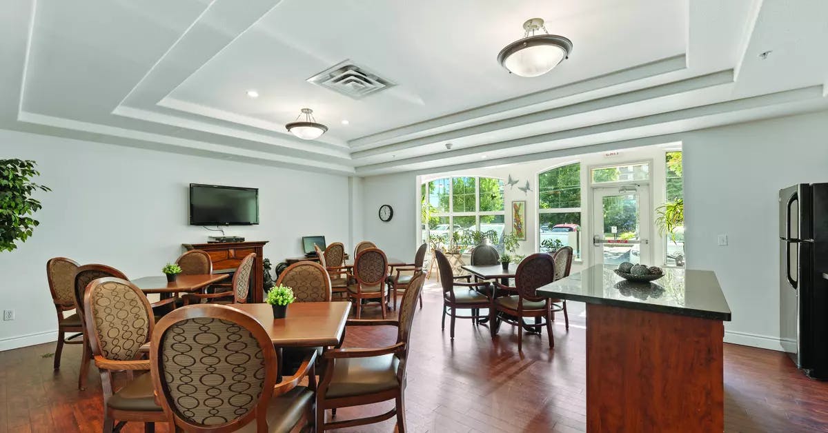 Chartwell Regency Retirement Residence   bistro with tv and seating