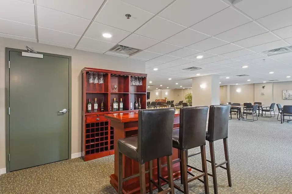 bar lounge with high top seating at chartwell emerald hills retirement residence
