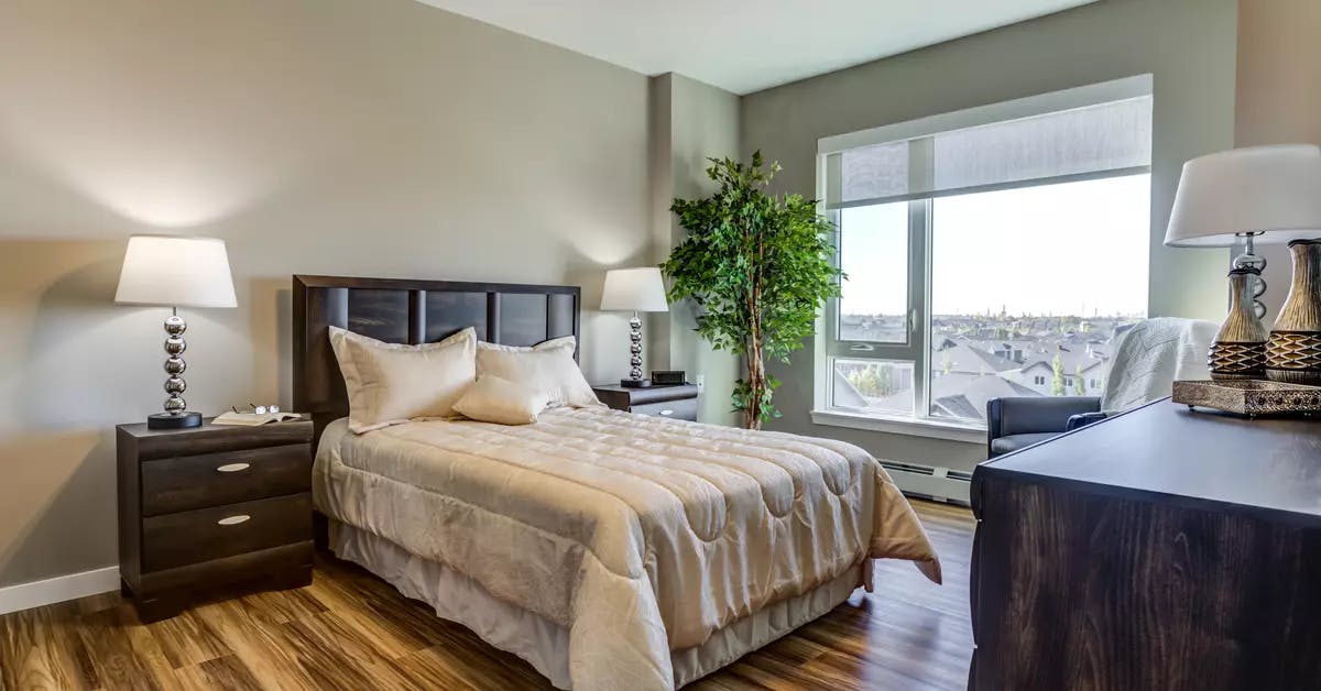 sunny and bright bedroom at chartwell emerald hills retirement residence