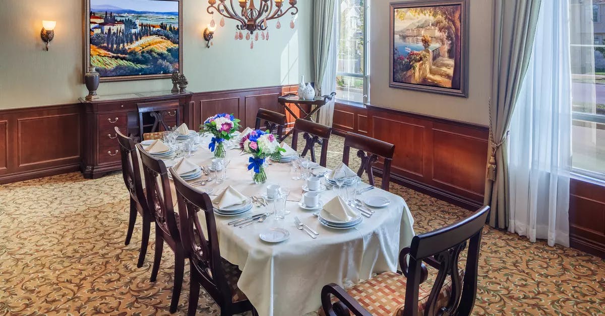 Open and inviting private dining room at Chartwell Valley Vista Retirement Residence 