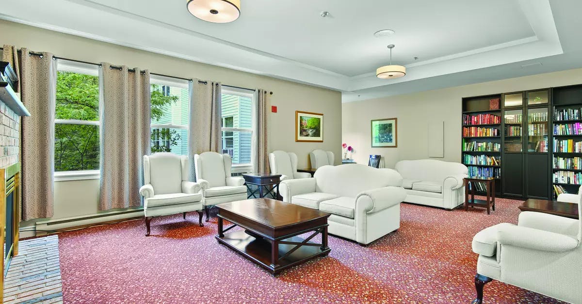 Open concept lounge and library at Chartwell Georgian Retirement Residence.