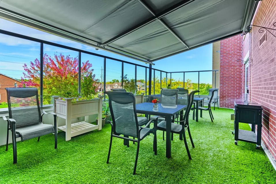 spacious covered patio at chartwell wynfield retirement residence