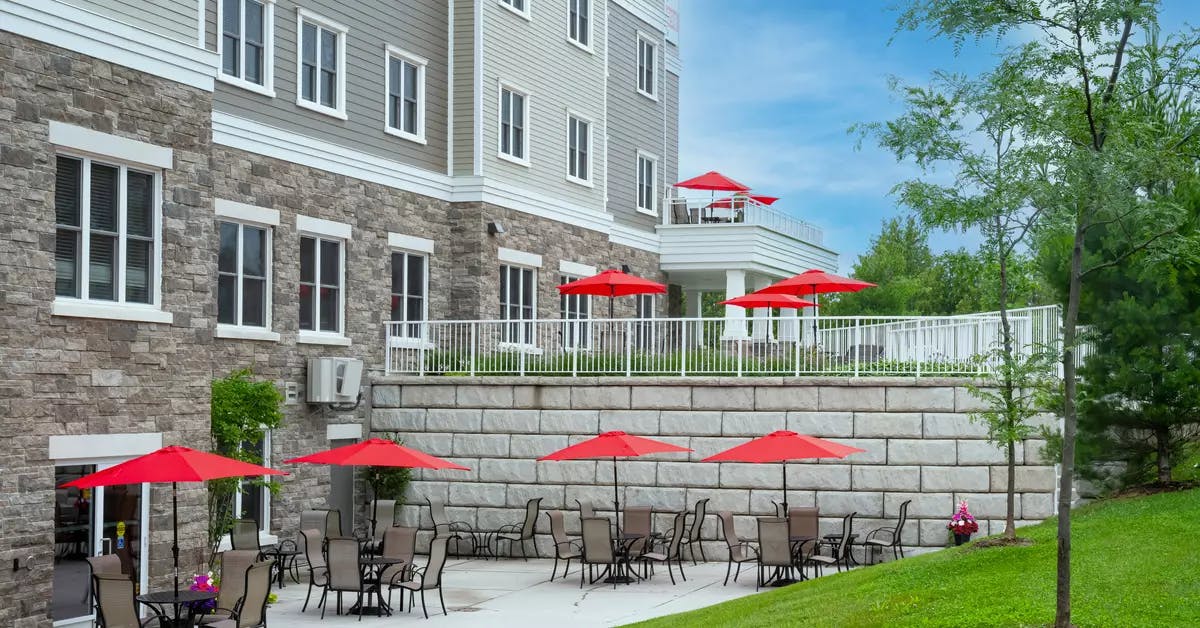Walk out patio with patio furniture at Chartwell Balmoral Retirement Community.