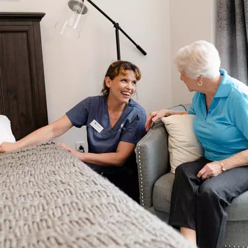 Chartwell Care staff making bed for the senior