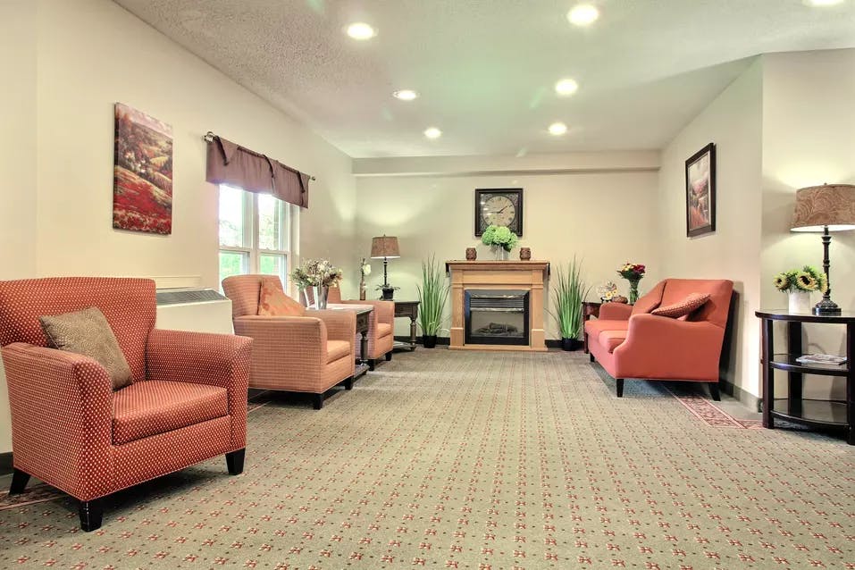 lounge with fireplace at chartwell hartford retirement residence