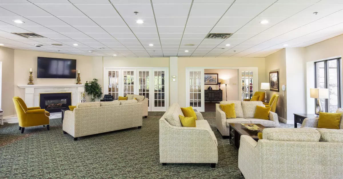 Chartwell Christopher Terrace Retirement Residence lounge with tv and fireplace