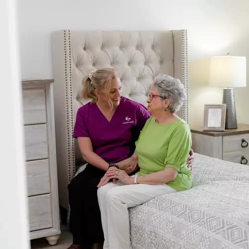 Chartwell Care staff chatting with the senior resident