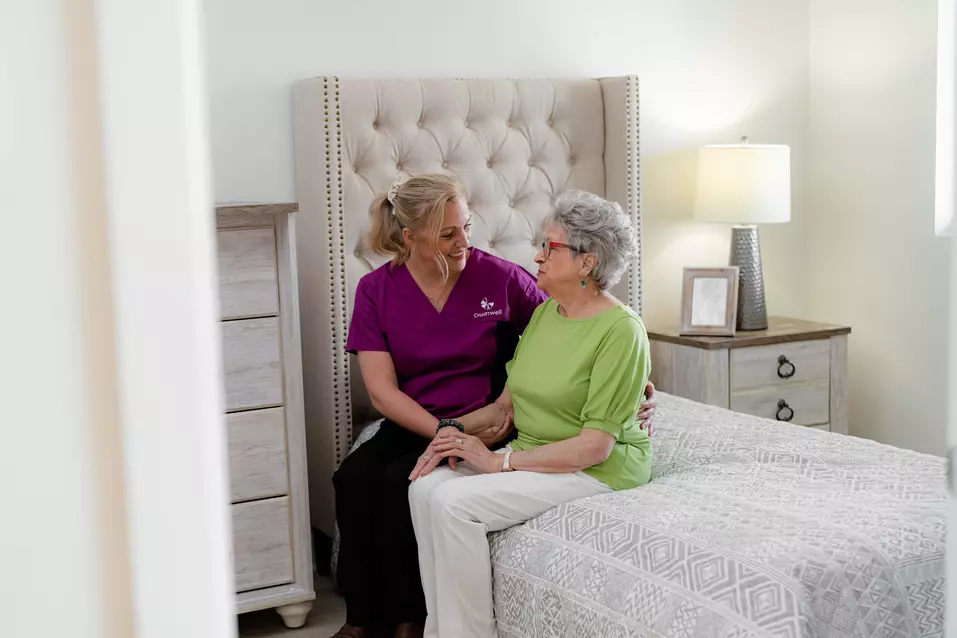 Chartwell Care staff chatting with the senior resident