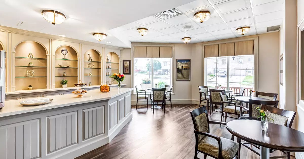 Open concept bistro with seating at Chartwell Bankside Retirement Residence