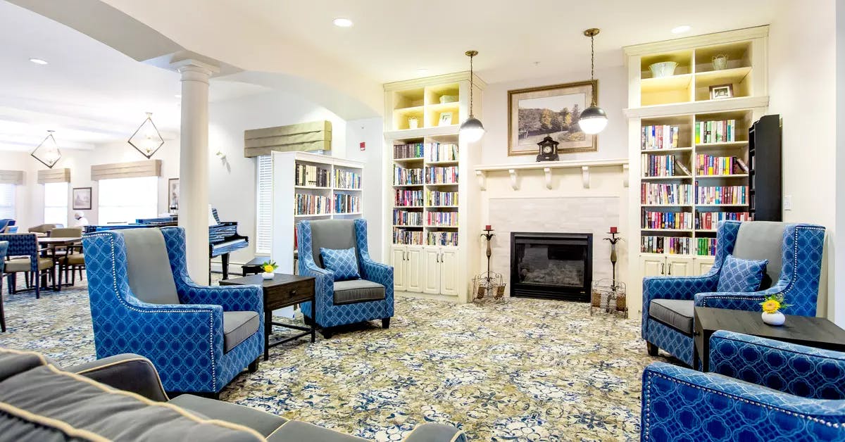 cozy and warm fireside lounge at chartwell hawthorn retirement residence