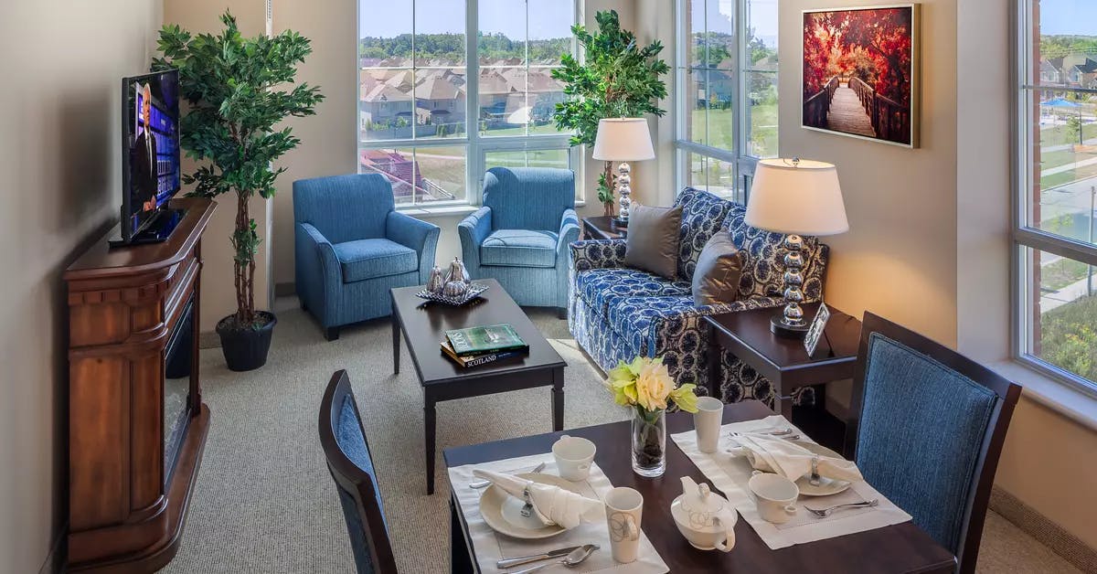 Bright suite living room with gorgeous views at Chartwell Valley Vista Retirement Residence 