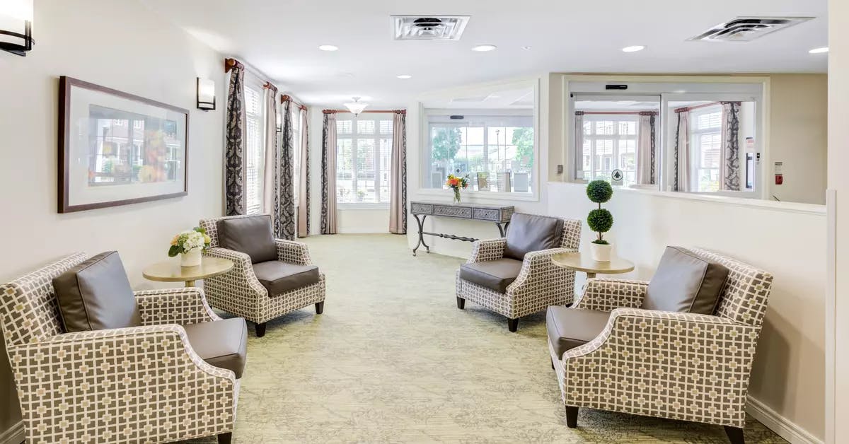 Bright and open lounge at Chartwell Orchards Retirement Residence