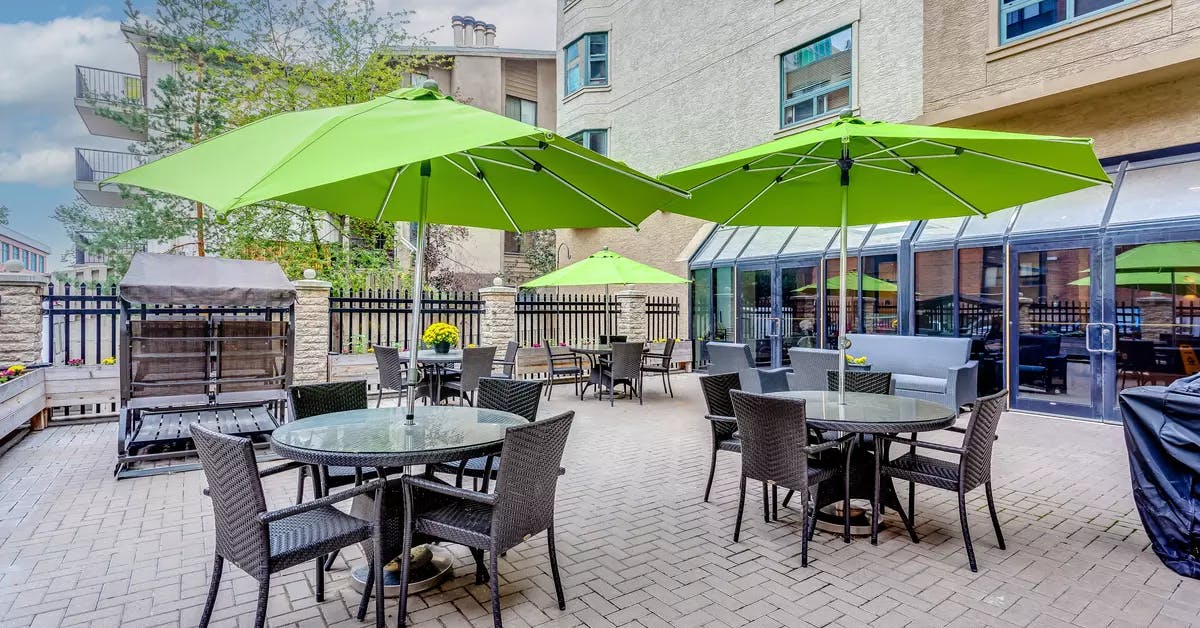 colourful courtyard at chartwell eau claire care residence