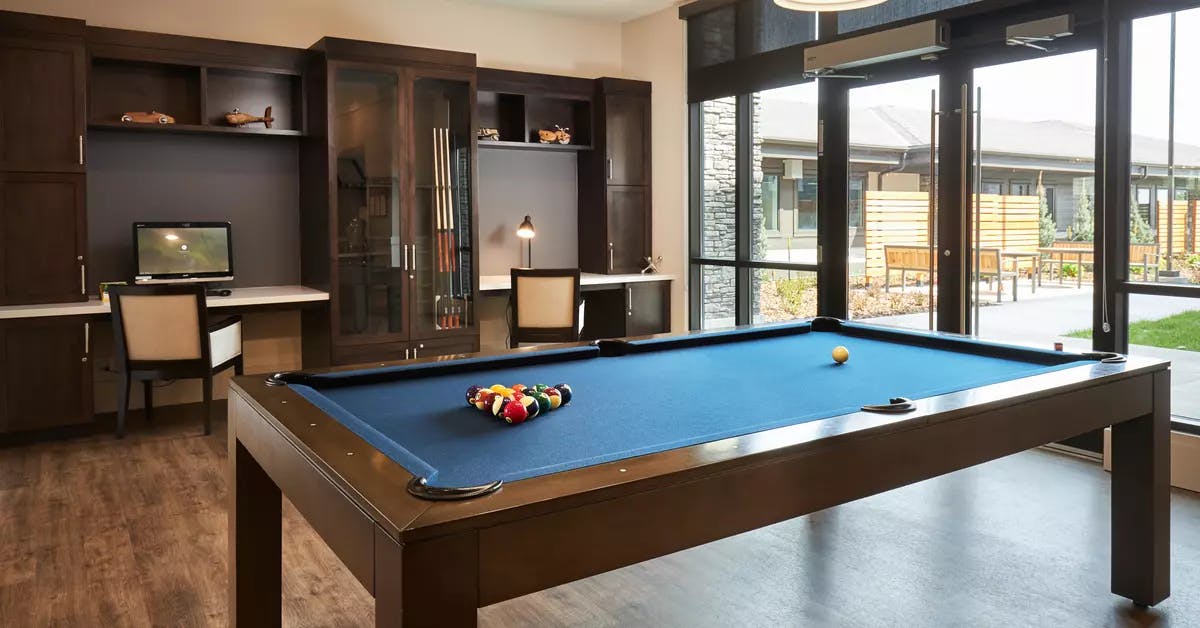 pool table lounge at chartwell wescott retirement residence