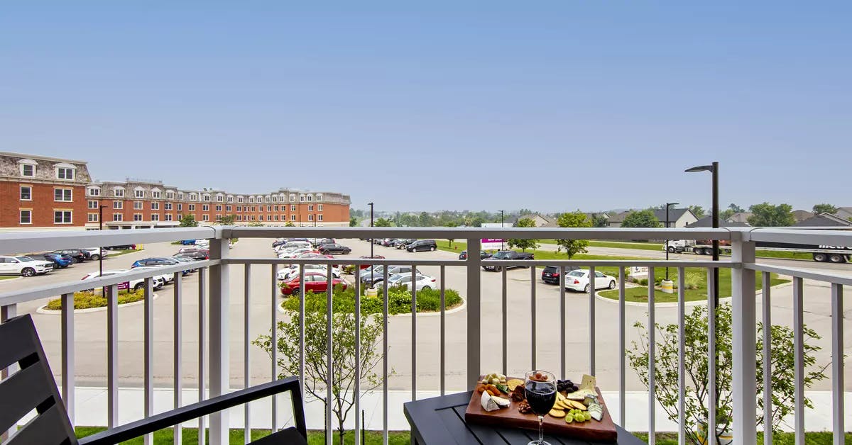 chartwell montgomery village,  balcony, suite, wine glass, cheese, crackers, parking lot