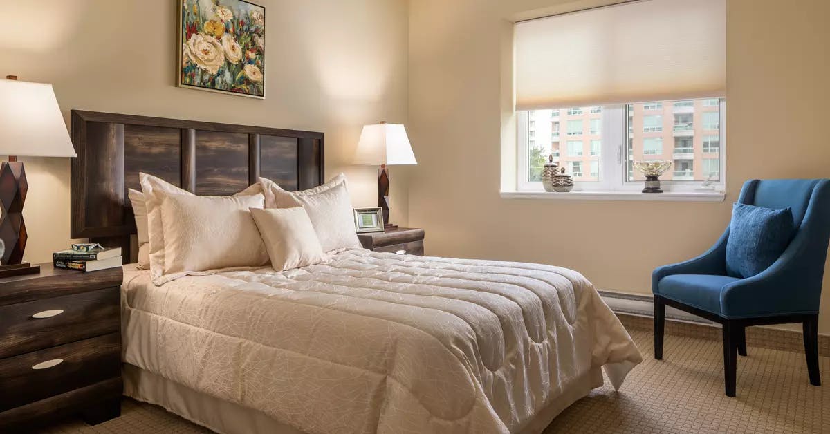 A comfy bedroom in a suite of Chartwell Constantia Retirement Residence 