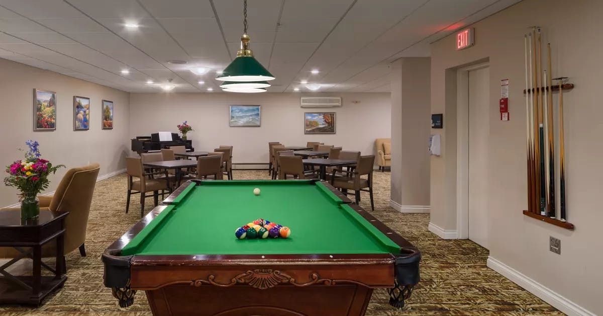 pool table lounge at chartwell willow care residence