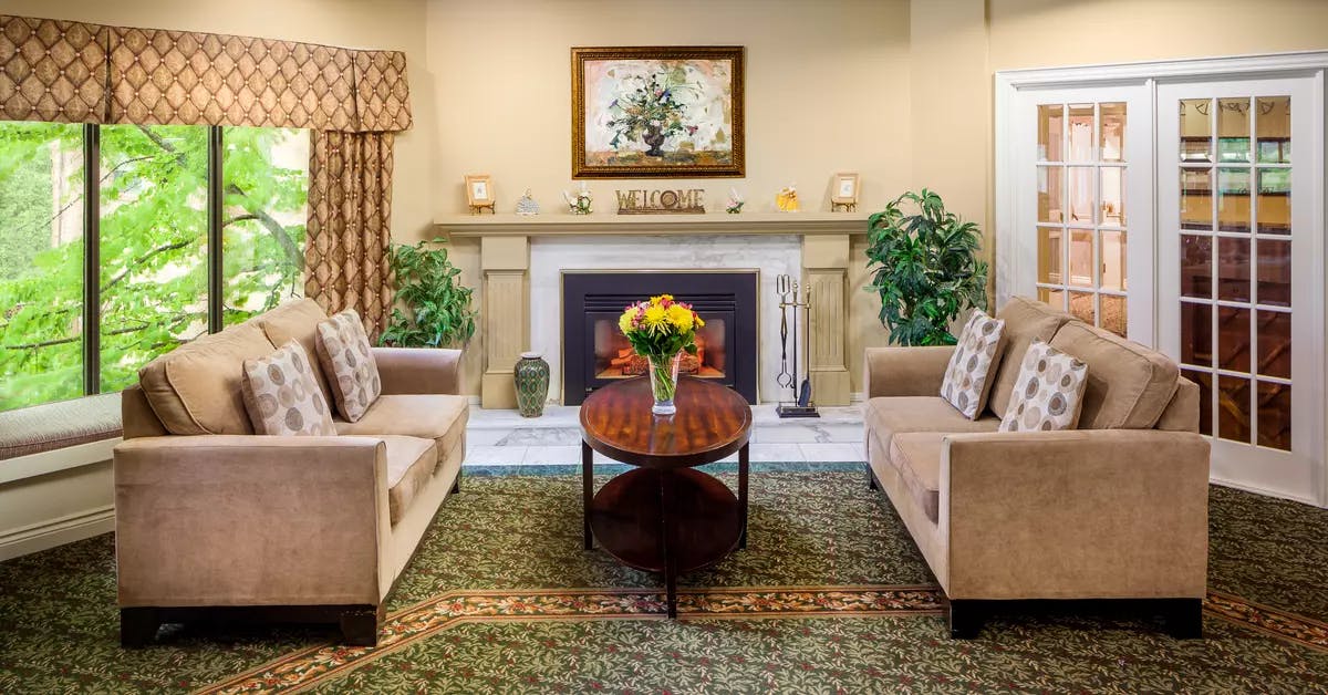 Chartwell Christopher Terrace Retirement Residence fireplace lounge with couches