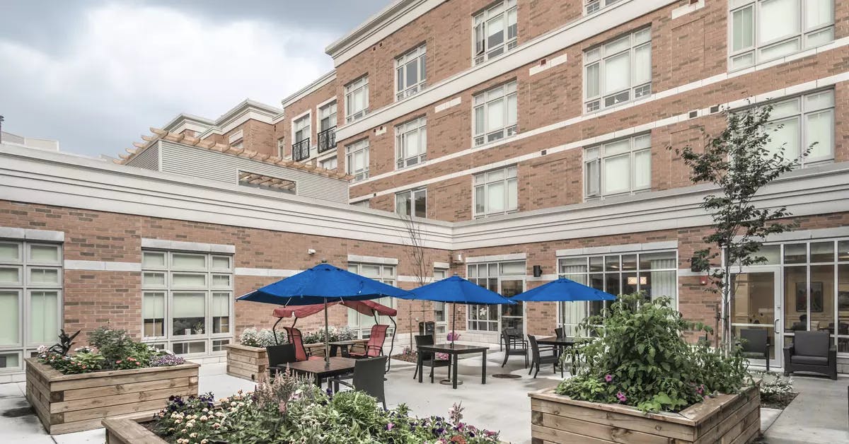 Gorgeous raised gardens and patio at Chartwell Waterford Retirement Residence